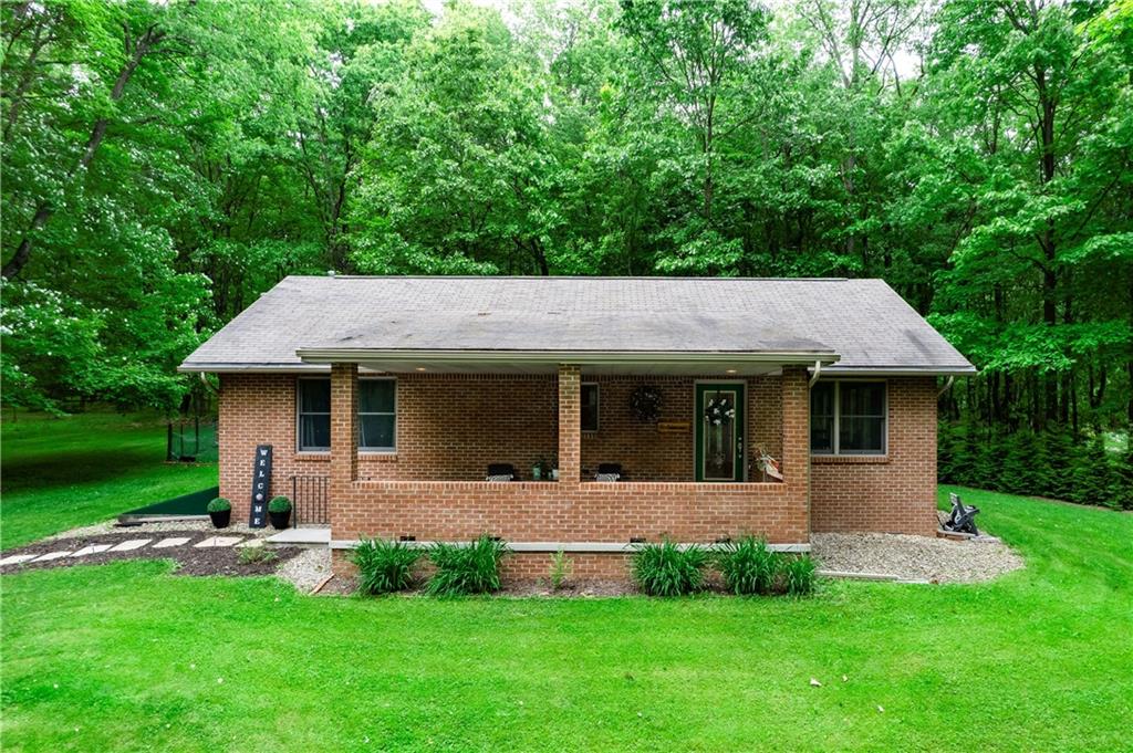 223 Cashdollar Road Mars, PA 16046 - Photo 3 of 42 a view of a house with a backyard and a patio
