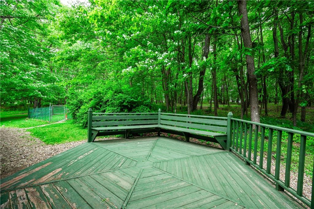 223 Cashdollar Road Mars, PA 16046 - Photo 34 of 42 a view of a bench in a garden with wooden fence