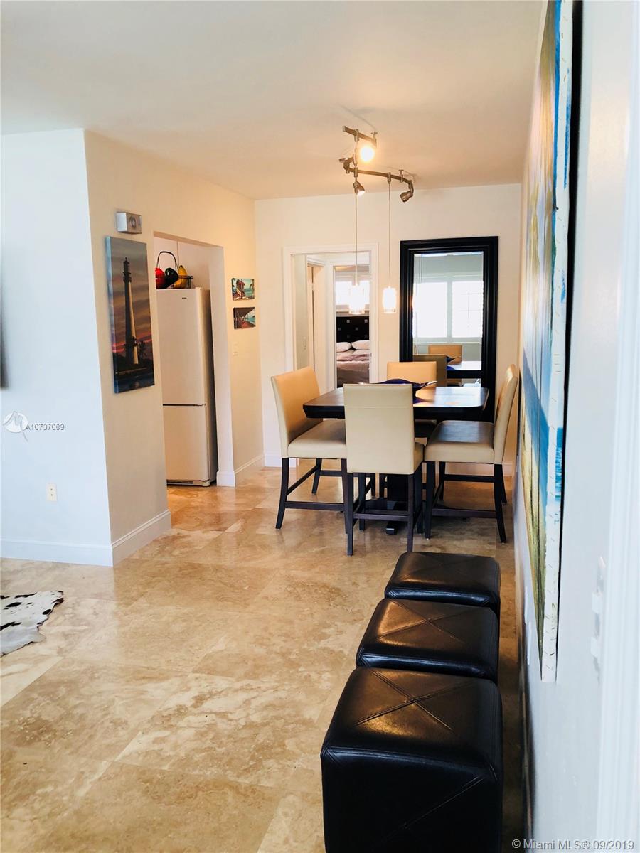 201 Sunrise Drive, Unit 109 Key Biscayne, FL 33149 - Photo 2 of 14 a view of a living room and dining room