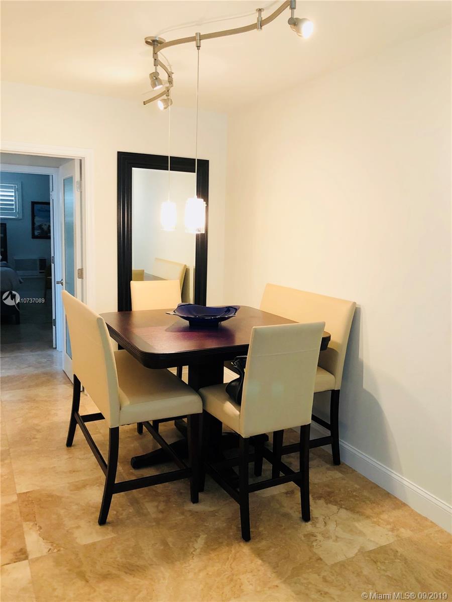 201 Sunrise Drive, Unit 109 Key Biscayne, FL 33149 - Photo 9 of 14 a view of a workspace with furniture