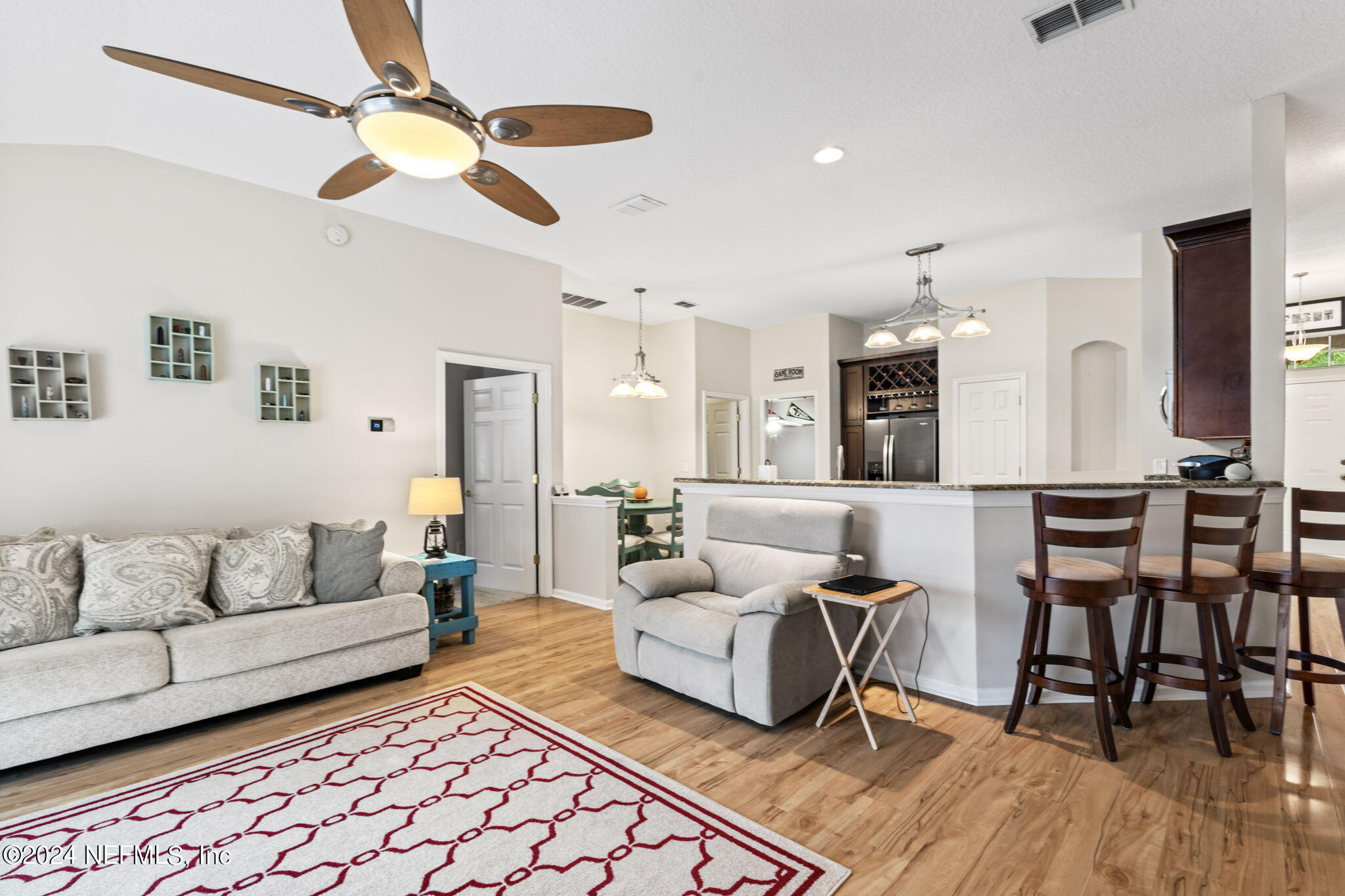 4301 Rye Court St. Johns, FL 32259 - Photo 17 of 47 a living room with furniture and a wooden floor