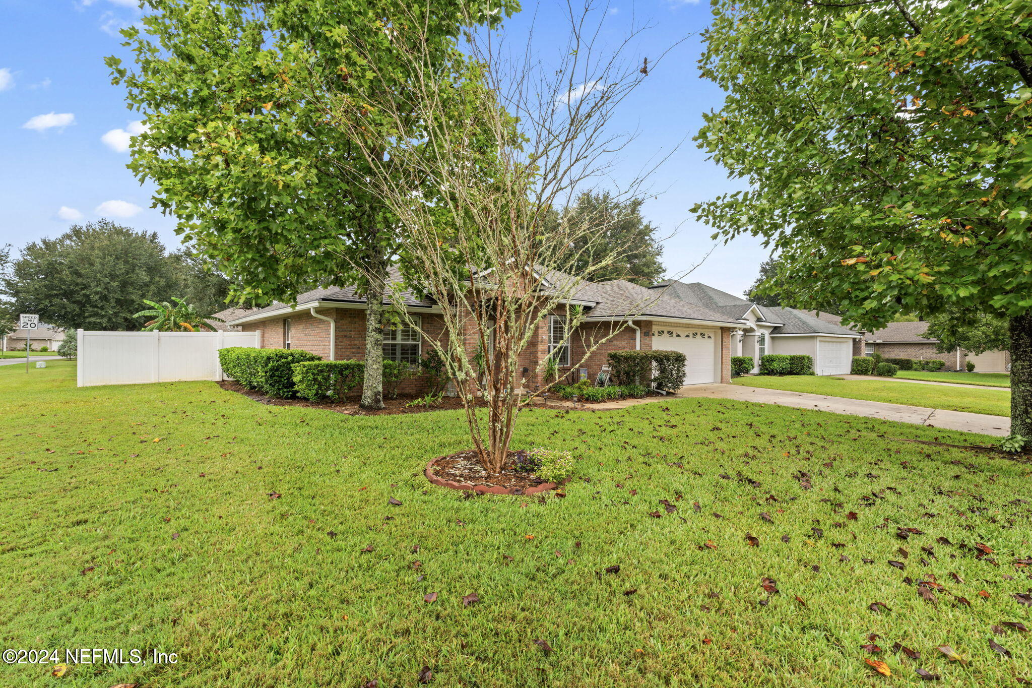 4301 Rye Court St. Johns, FL 32259 - Photo 40 of 47 a front view of a house with a yard and trees