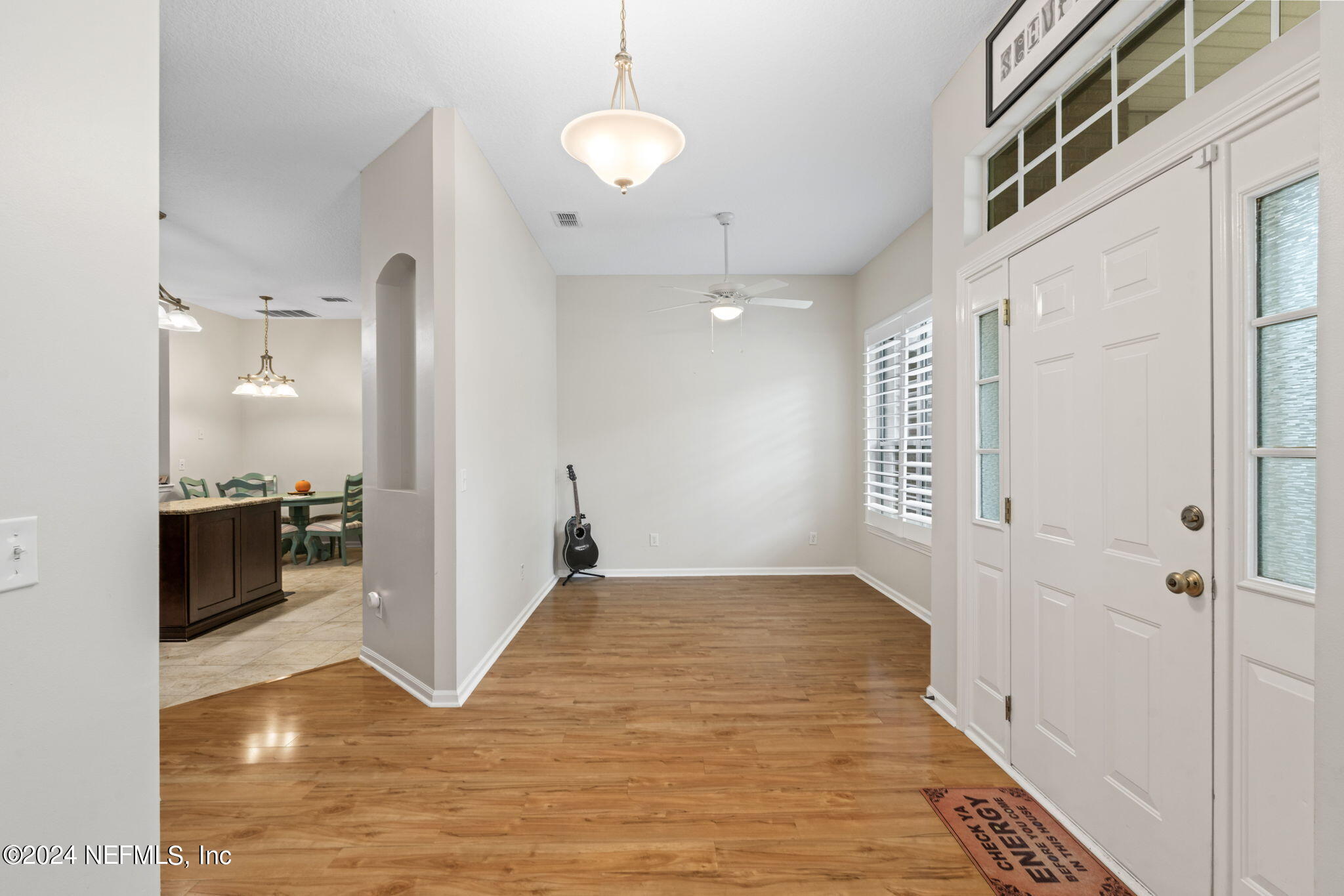 4301 Rye Court St. Johns, FL 32259 - Photo 6 of 47 a view of a refrigerator in kitchen and an empty room