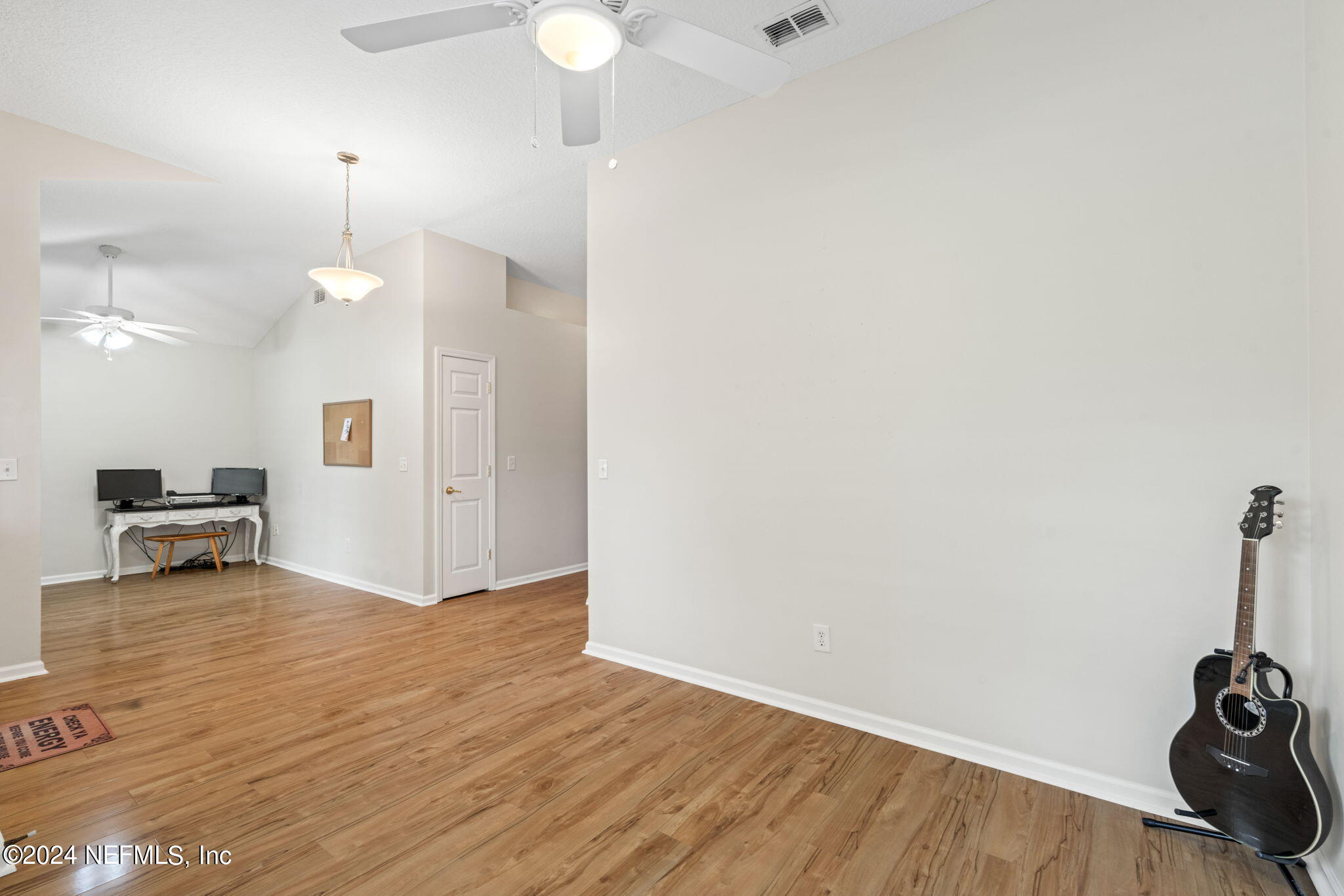 4301 Rye Court St. Johns, FL 32259 - Photo 8 of 47 a view of a room with wooden floor and white walls