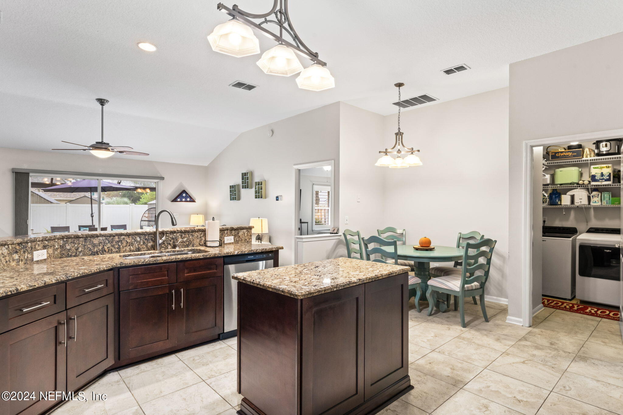 4301 Rye Court St. Johns, FL 32259 - Photo 10 of 47 a kitchen with a sink and chairs