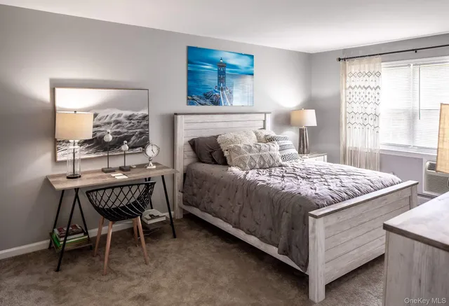 a bedroom with a bed and a table in it