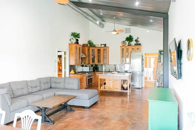 a living room with furniture and a large window