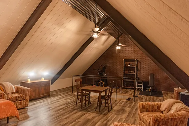 a living room with furniture and wooden floors