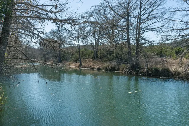 a view of lake with green space