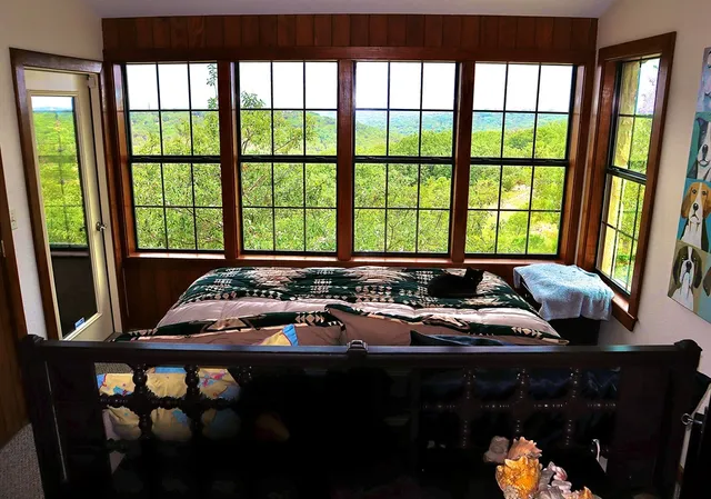 a room with furniture and large windows