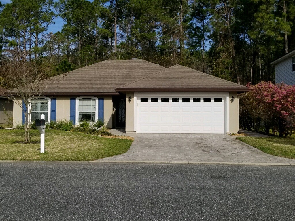 86279 Fortune Drive Yulee, FL 32097 - Photo 1 of 5 a house with a yard