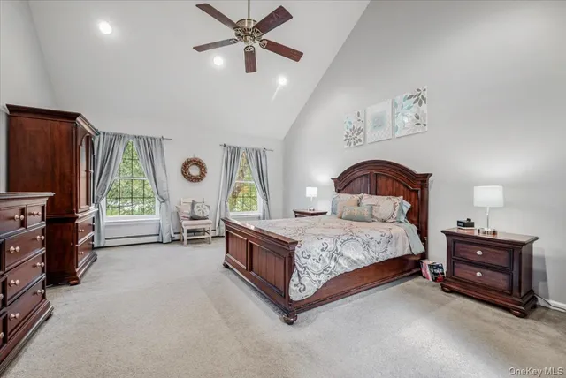 a bedroom with a bed dresser and a window