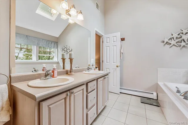 a bathroom with a sink a vanity and a mirror