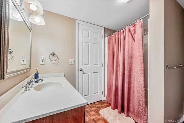 a roof deck with a potted plant and outdoor seating
