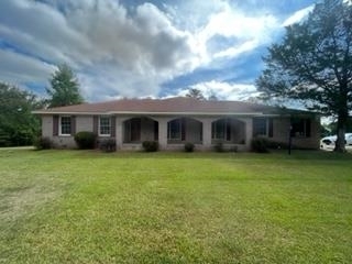 a view of a house with a garden