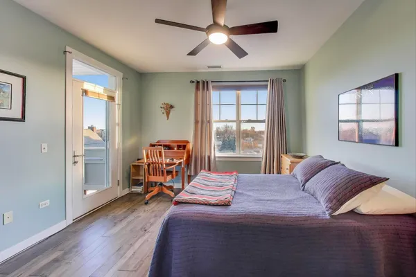 a bedroom with a bed closet and a window