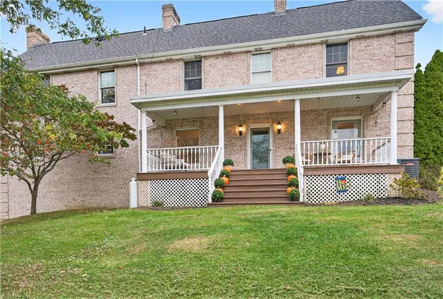 front view of a house with a garden