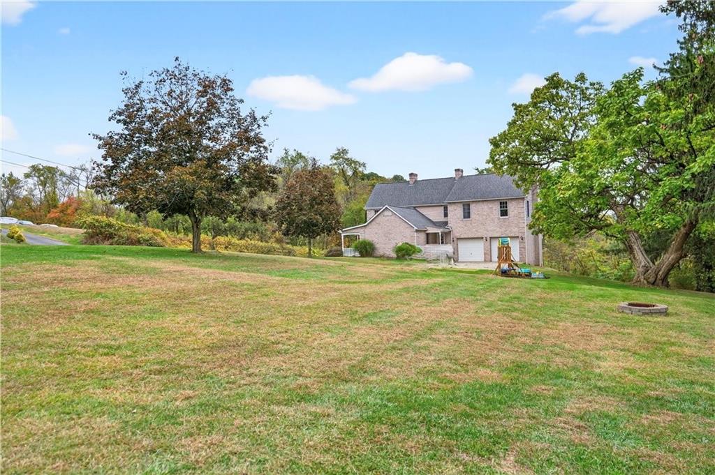 420 Kennedy Road Charleroi, PA 15022 - Photo 32 of 40 a view of a big house with a big yard and large trees