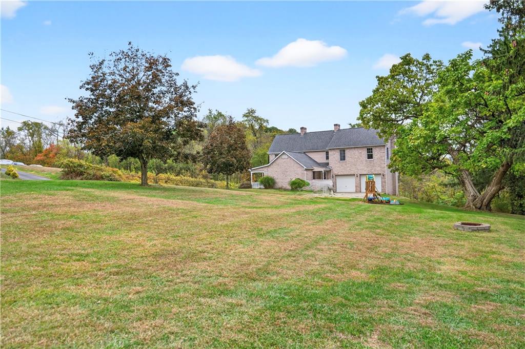 420 Kennedy Road Charleroi, PA 15022 - Photo 35 of 40 a view of a big house with a big yard and large trees