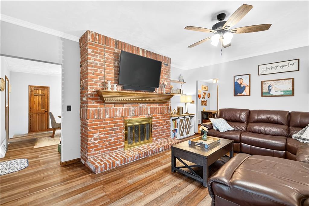 420 Kennedy Road Charleroi, PA 15022 - Photo 7 of 40 a living room with furniture a flat screen tv and a fireplace