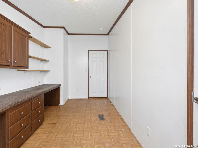 135 Savannah Ridge Von Ormy, TX 78073 - Photo 18 of 45 a hallway with sink and cabinets
