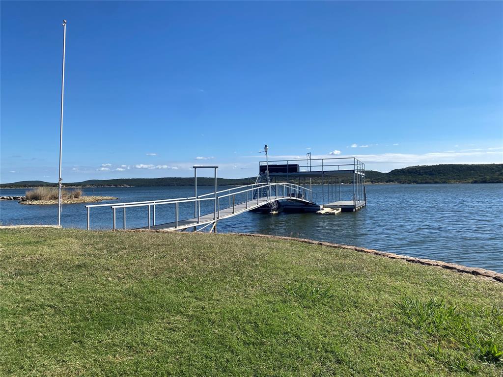 4415 Chapel Road Graham, TX 76450 - Photo 15 of 40 a view of a pool with a yard