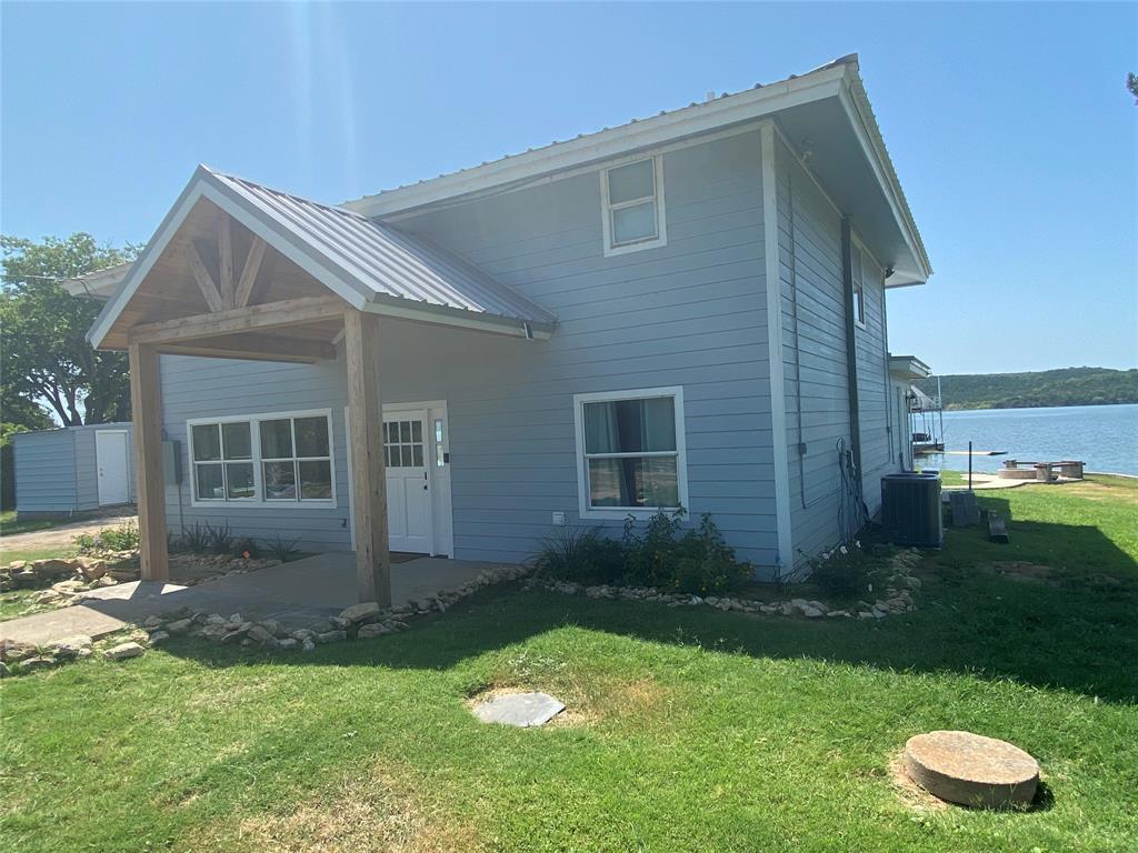 4415 Chapel Road Graham, TX 76450 - Photo 2 of 40 a view of a house with a yard