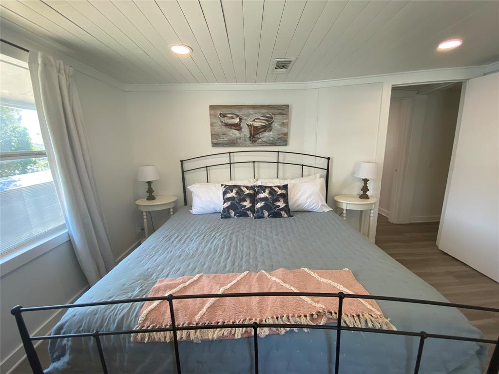 4415 Chapel Road Graham, TX 76450 - Photo 22 of 40 a view of a room with furniture and wooden floor