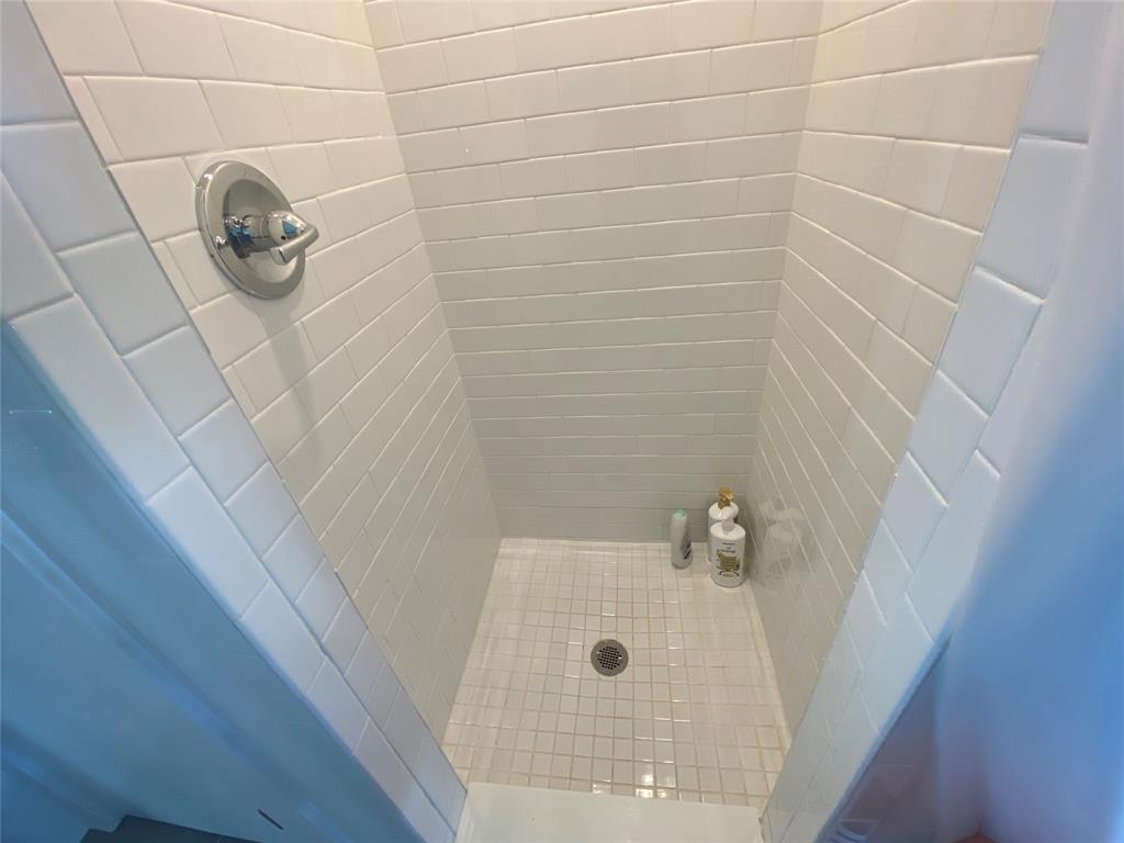 4415 Chapel Road Graham, TX 76450 - Photo 23 of 40 a bathroom with a shower