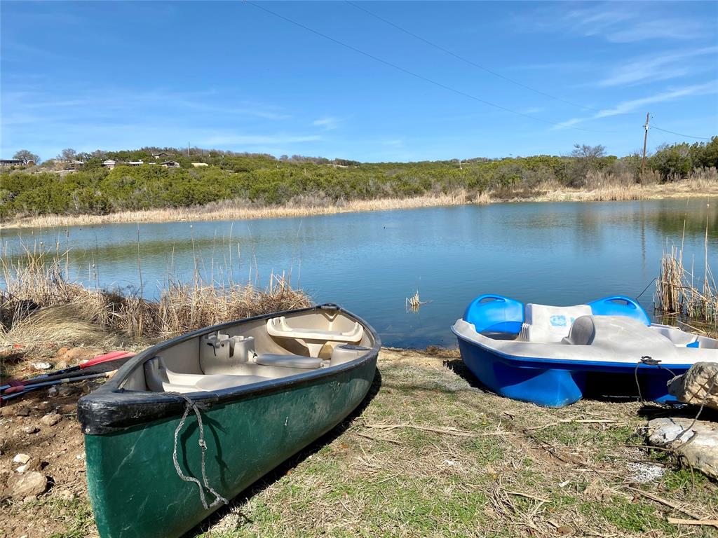 4415 Chapel Road Graham, TX 76450 - Photo 24 of 40 a wooden deck with lake view and mountain view