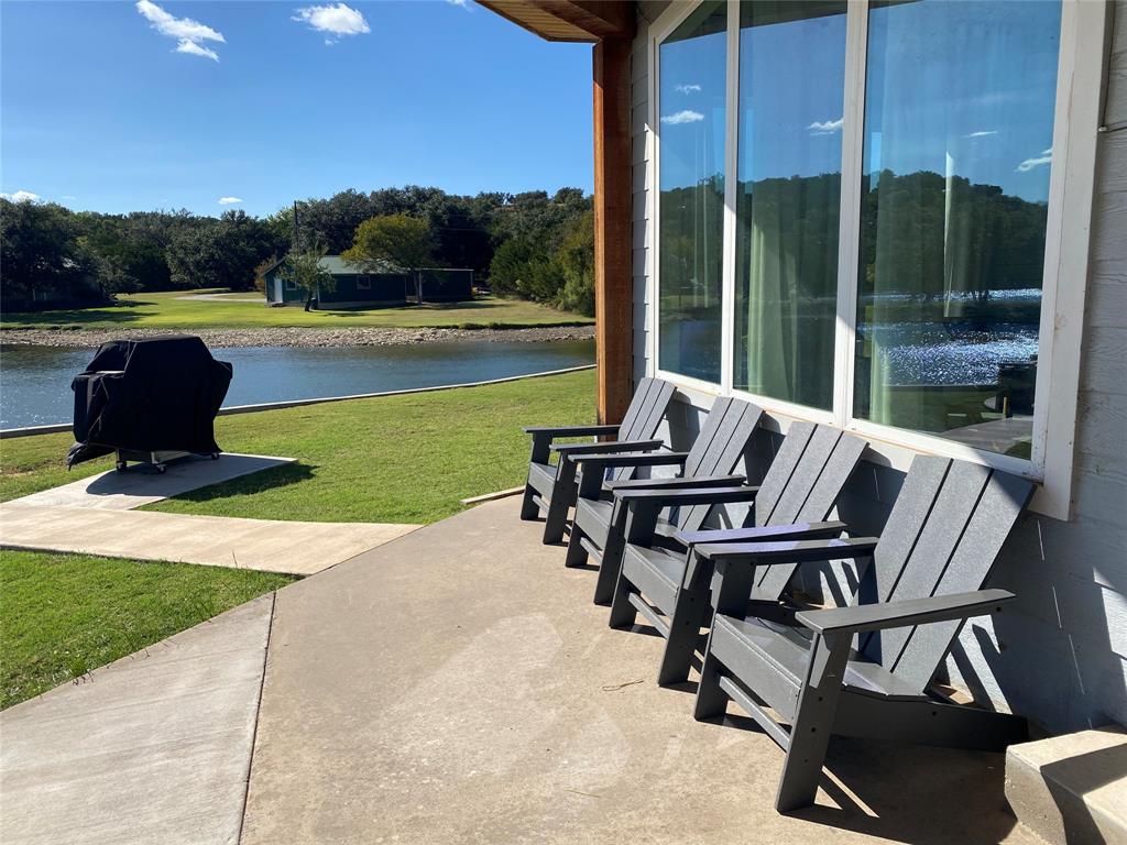 4415 Chapel Road Graham, TX 76450 - Photo 36 of 40 a view of swimming pool with lawn chairs and a yard