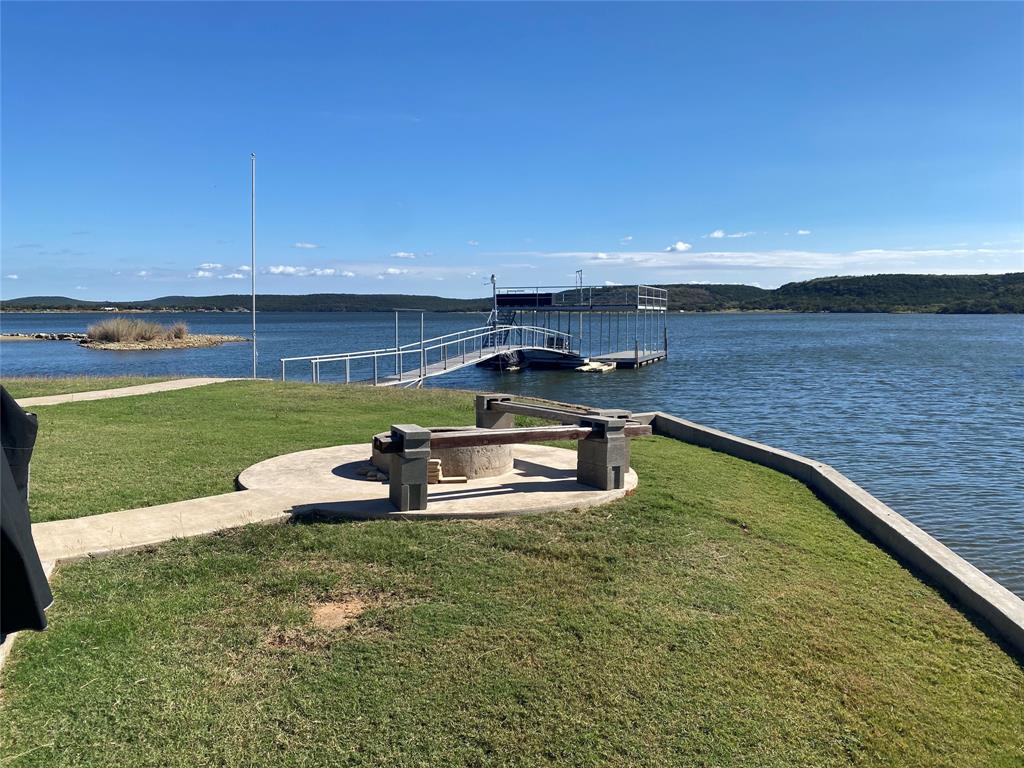 4415 Chapel Road Graham, TX 76450 - Photo 38 of 40 a swimming pool with outdoor seating and yard