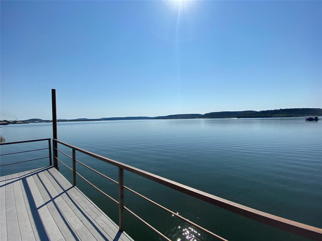 4415 Chapel Road Graham, TX 76450 - Photo 4 of 40 a view of a balcony with wooden floor
