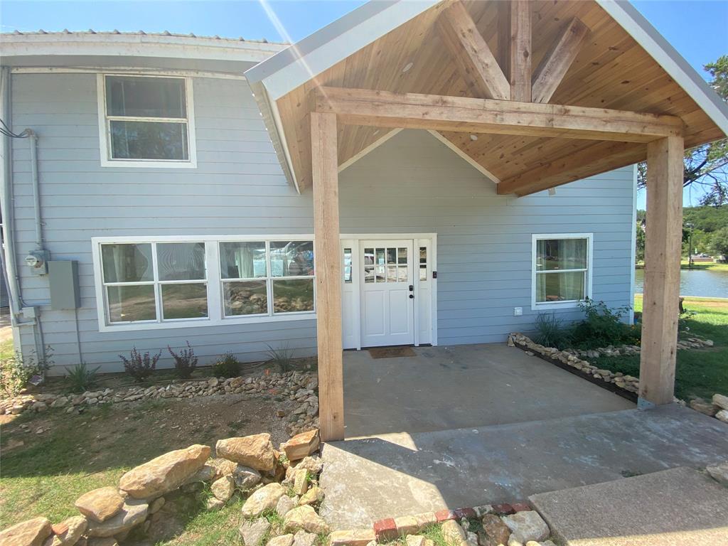 4415 Chapel Road Graham, TX 76450 - Photo 5 of 40 a front view of a house with a yard