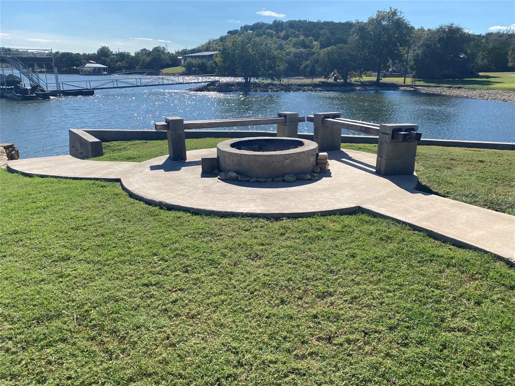 4415 Chapel Road Graham, TX 76450 - Photo 6 of 40 a view of a lake with a house in the background