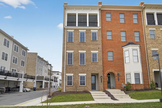 a front view of a building with a yard