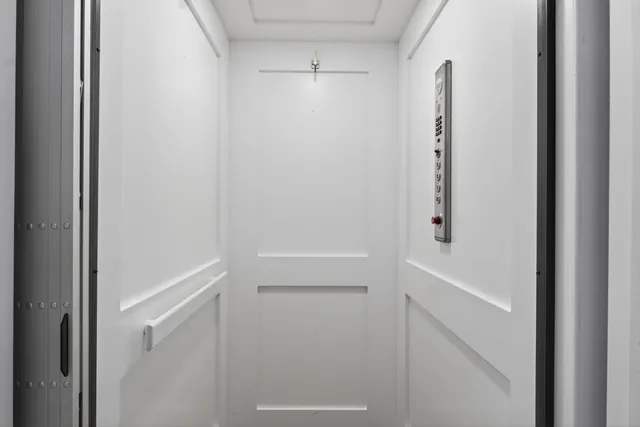 a kitchen with stainless steel appliances a sink a refrigerator a stove a microwave and cabinets