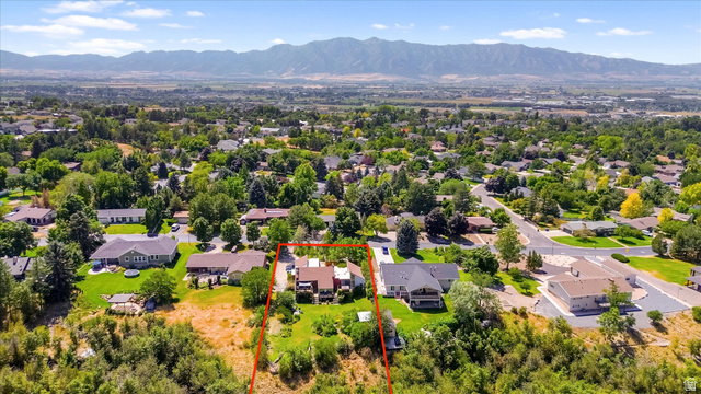 510 Spring Creek Road Providence, UT 84332 - Photo 87 of 97 Expansive residential property with a multi-level home featuring a brown roof and light-toned siding, set on a verdant lot