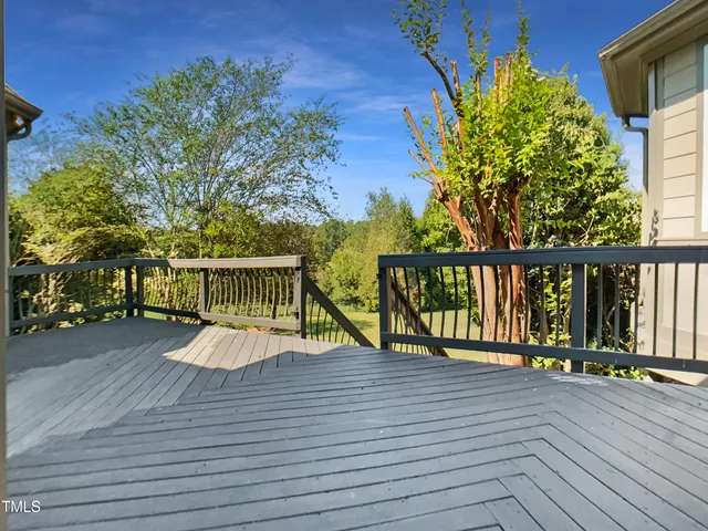 a view of a house with wooden deck