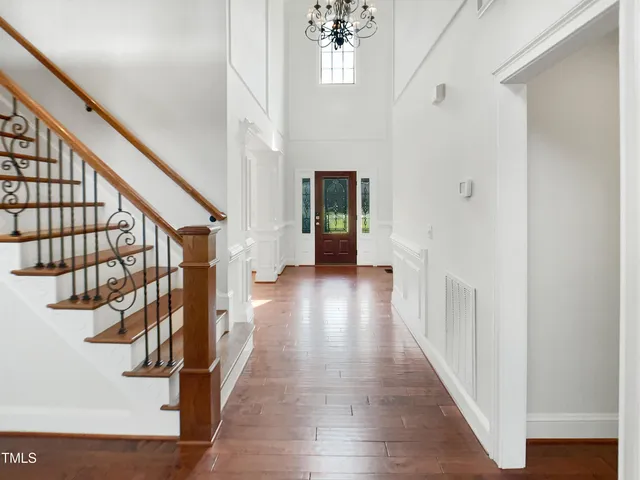a view of an entryway with wooden floor