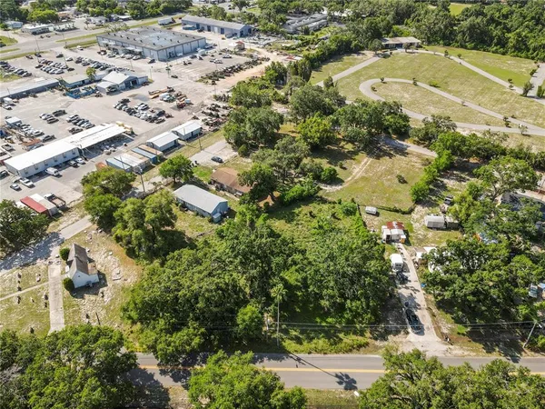 an aerial view of residential house with beach and swimming pool