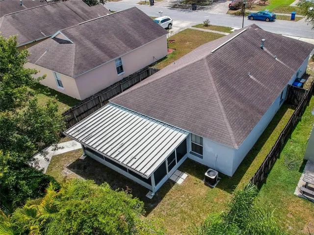 a view of a backyard with sitting area