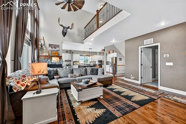 a living room with lots of furniture and a rug