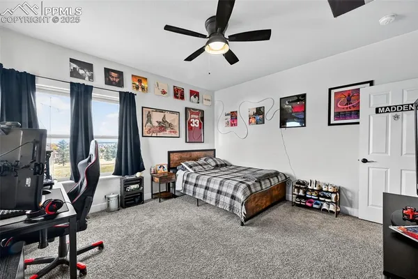 a bedroom with bed and a window