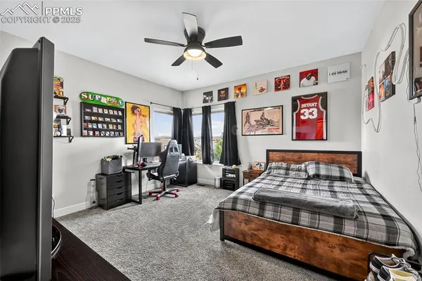 a bedroom with furniture and a window