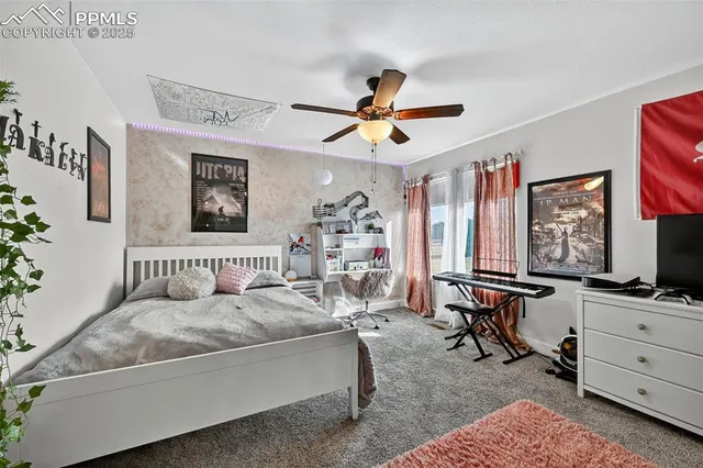 a bedroom with furniture and a window