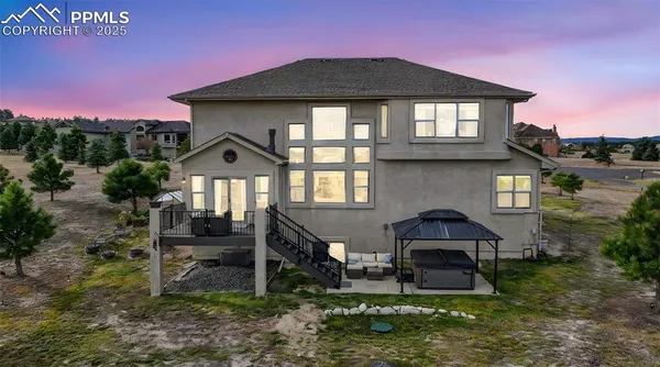 a front view of a house with yard and green space