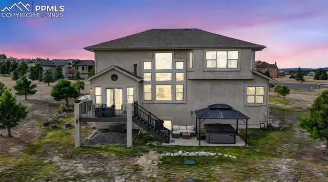 a front view of a house with yard and green space