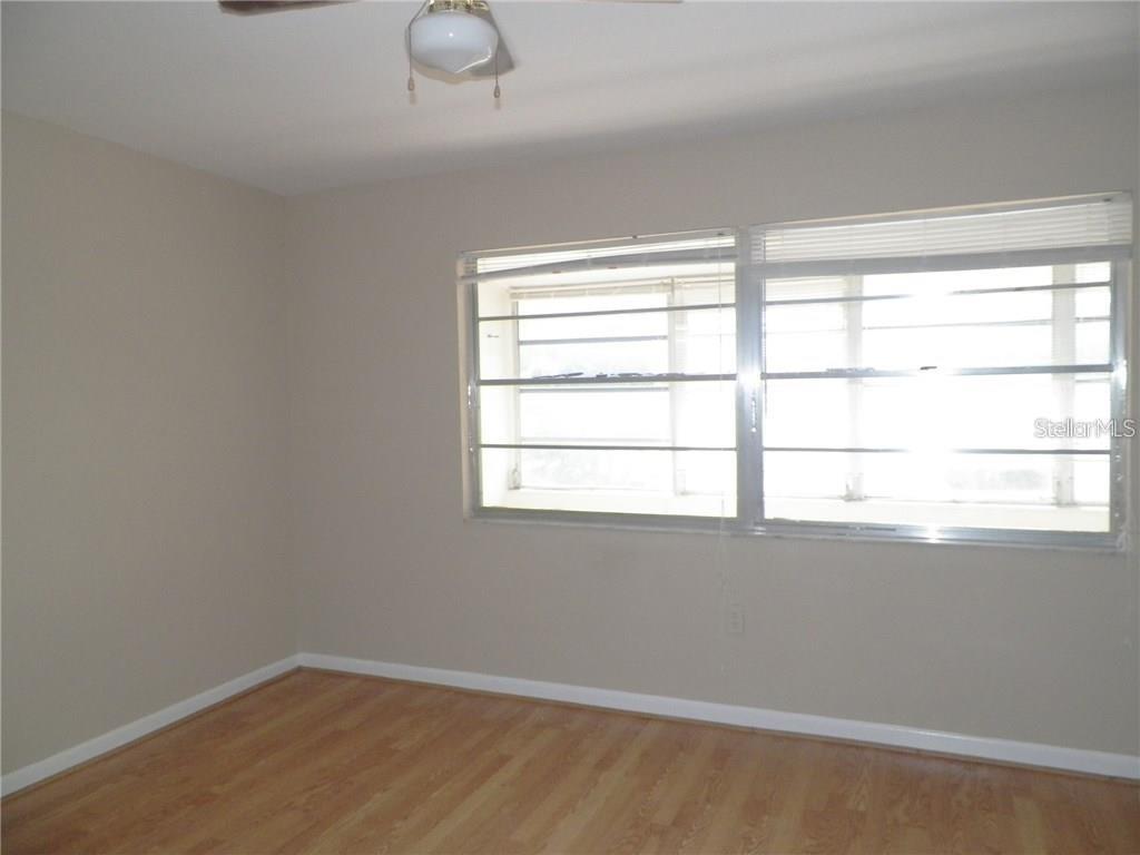 911 Washington Avenue Southwest, Unit 304 Largo, FL 33770 - Photo 13 of 26 an empty room with a window