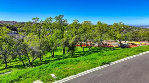 a view of a park with large trees